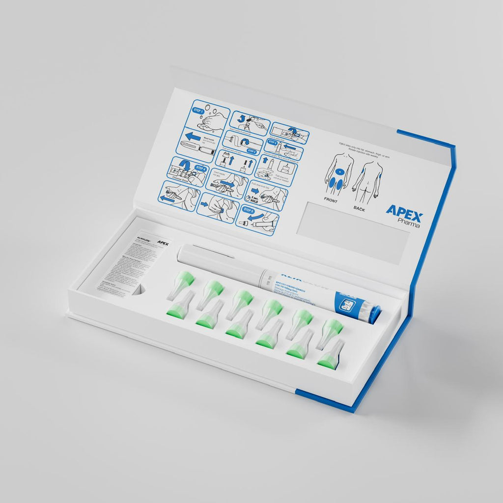 Medical kit with syringes and instructions on a gray background